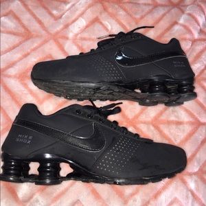 Black Nike shocks.